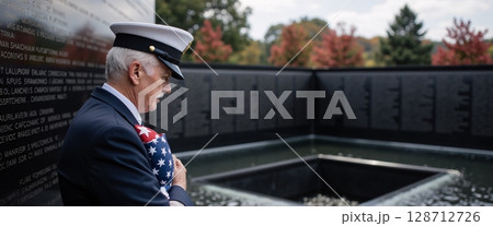 Emotional Tribute at Veteran Memorial with Flag and Soldier in Military Uniform Emotional Tribute at Veteran Memorial with Flag and Soldier in Military Uniform 128712726