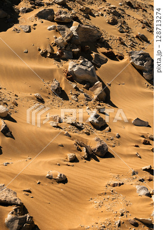 White rock formations and sand dunes in Egypt's White Desert, natural desert landscape White rock formations and sand dunes in Egypt's White Desert, natural desert landscape 128713274