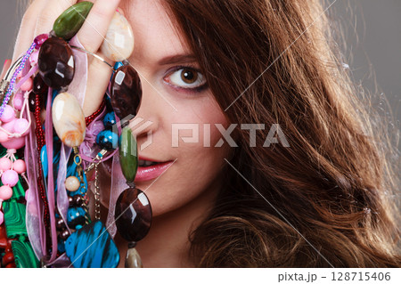 Pretty woman with jewelry necklaces ring bracelets 128715406