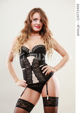 Smiling girl wearing sexy lingerie 128715409