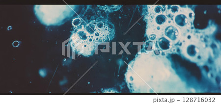 Close-up of mold and decay on an old film surface, showcasing organic textures and spots. 128716032