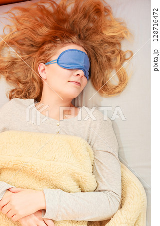 Sleeping woman wearing blindfold sleep mask. 128716472