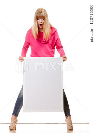 woman holding blank presentation board woman holding blank presentation board 128716500