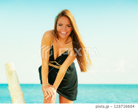Beautiful sexy girl on seashore Beautiful sexy girl on seashore 128716684