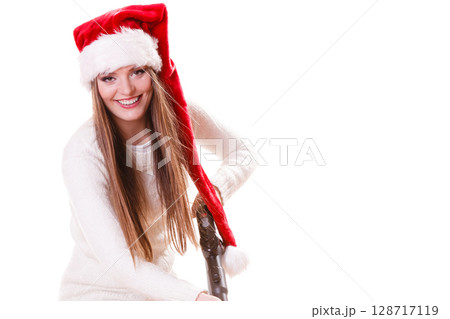 Girl santa claus hat with vacuum cleaner Girl santa claus hat with vacuum cleaner 128717119