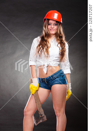 Sexy strong woman feminist with axe working. 128717207