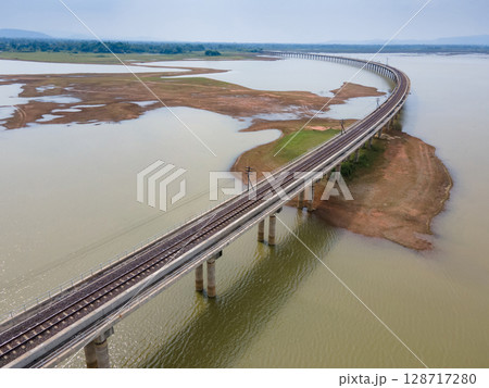 Aerial view of railway track bridge at Pasak Chonlasit Dam in Lopburi, Thailand Aerial view of railway track bridge at Pasak Chonlasit Dam in Lopburi, Thailand 128717280