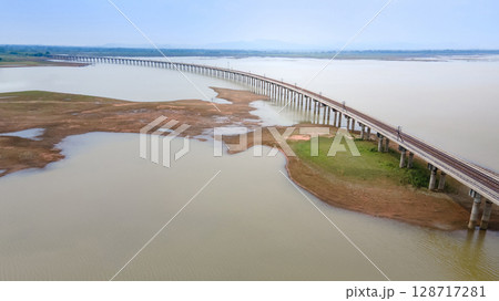 Aerial view of railway track bridge at Pasak Chonlasit Dam in Lopburi, Thailand Aerial view of railway track bridge at Pasak Chonlasit Dam in Lopburi, Thailand 128717281