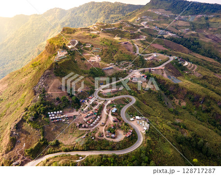 Aerial view of curvy road with hillside resorts up to Phu Tub Berk in Phetchabun, Thailand 128717287
