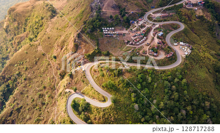 Aerial view of curvy road with hillside resorts up to Phu Tub Berk in Phetchabun, Thailand 128717288