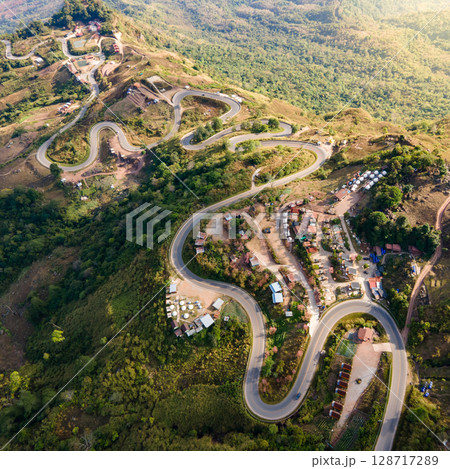 Aerial view of curvy road with hillside resorts up to Phu Tub Berk in Phetchabun, Thailand 128717289