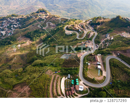 Aerial view of curvy road with hillside resorts up to Phu Tub Berk in Phetchabun, Thailand 128717293