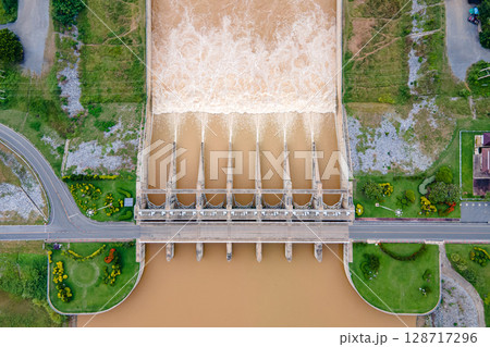 Aerial top view of Pasak Chonlasit Dam, a hydroelectric dam located in Lopburi, Thailand. 128717296