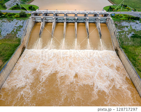 Aerial top view of Pasak Chonlasit Dam, a hydroelectric dam located in Lopburi, Thailand. 128717297