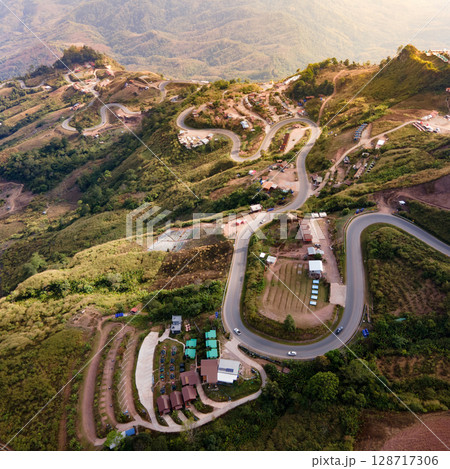 Aerial view of curvy road with hillside resorts up to Phu Tub Berk in Phetchabun, Thailand Aerial view of curvy road with hillside resorts up to Phu Tub Berk in Phetchabun, Thailand 128717306