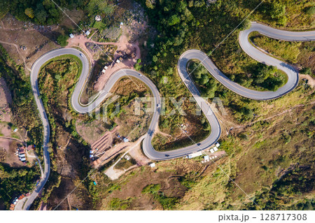 Aerial view of curvy road with hillside resorts up to Phu Tub Berk in Phetchabun, Thailand 128717308