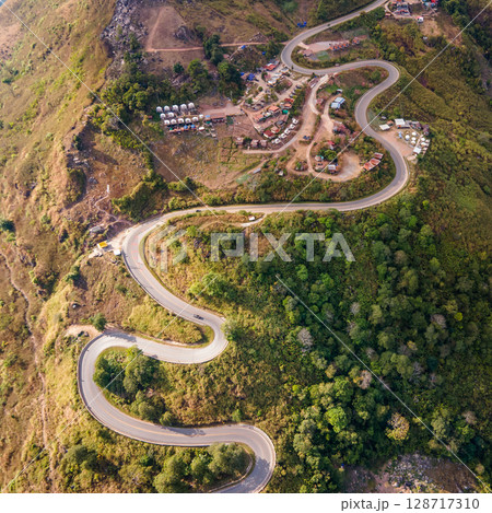Aerial view of curvy road with hillside resorts up to Phu Tub Berk in Phetchabun, Thailand 128717310