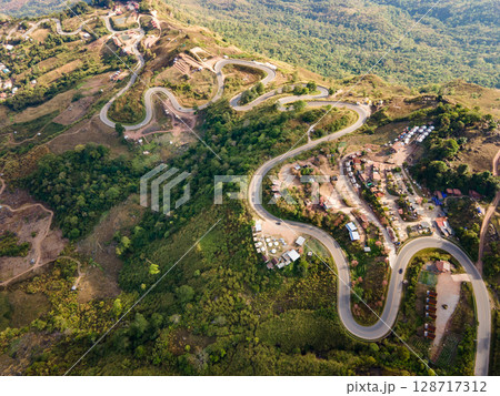 Aerial view of curvy road with hillside resorts up to Phu Tub Berk in Phetchabun, Thailand 128717312