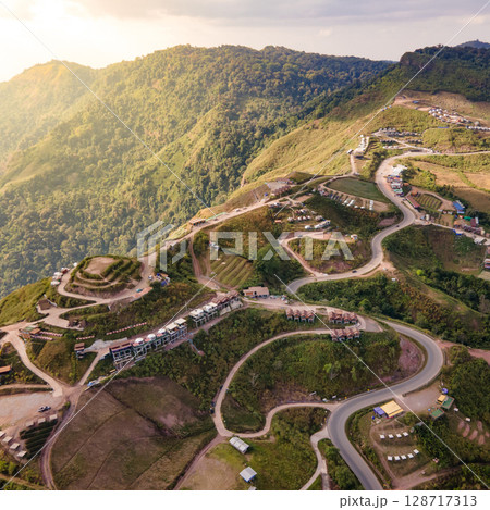 Aerial view of curvy road with hillside resorts up to Phu Tub Berk in Phetchabun, Thailand 128717313