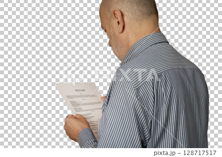 A man reading a resume 128717517