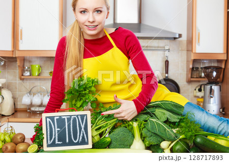 Woman having green diet vegetables, detox sign Woman having green diet vegetables, detox sign 128717893