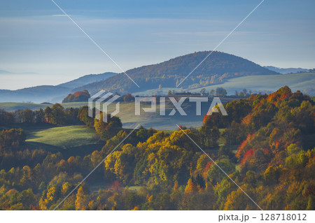 Colorful autumn foliage covering rolling hills in Banska Stiavnica, Slovakia Colorful autumn foliage covering rolling hills in Banska Stiavnica, Slovakia 128718012