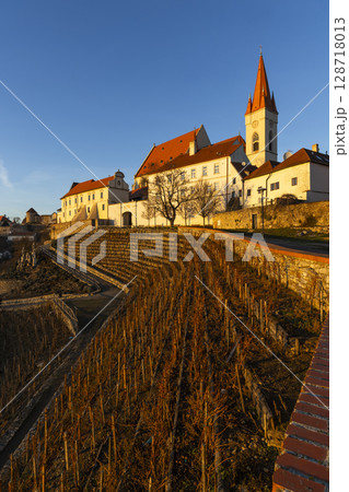Znojmo vineyard and Church of Saint Nicholas illuminating under the sunset in Czechia 128718013