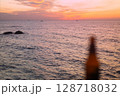 Blurred Beer Bottle on Sunset Sea Background 128718032