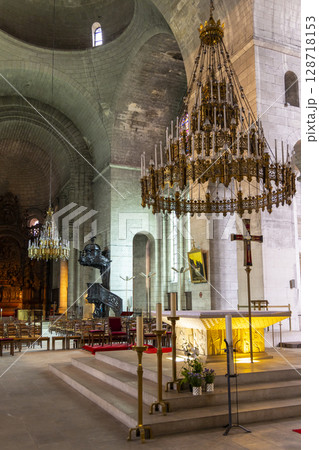 Interior of the Saint Front Cathedral showing altar, pulpit and chandeliers in Perigueux, France 128718153