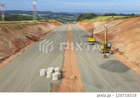 Excavators working on highway construction in Czechia, Stredocesky kraj Excavators working on highway construction in Czechia, Stredocesky kraj 128718318