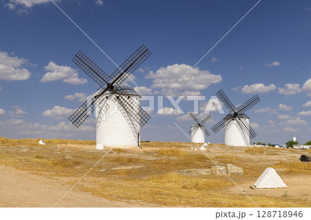 Traditional windmills standing on a hill in Campo de Criptana, Spain 128718946