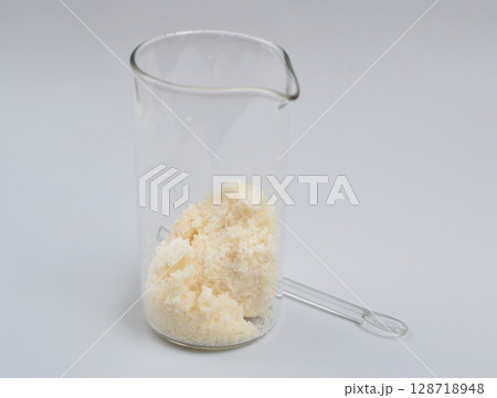Sodium Oleate powder on light grey background. 128718948