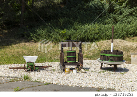 Old grape processing machines standing outdoor in Slovakia 128719252