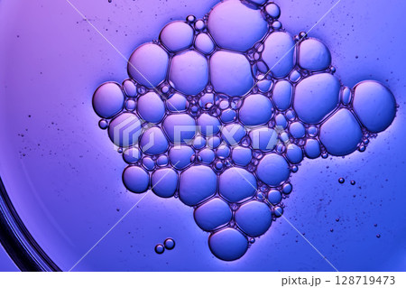 A very beautiful texture of serum or shampoo with bubbles in close-up. 128719473