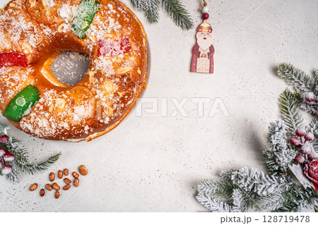 Roscon de reyes is a traditional Spanish Christmas pastry cake 128719478