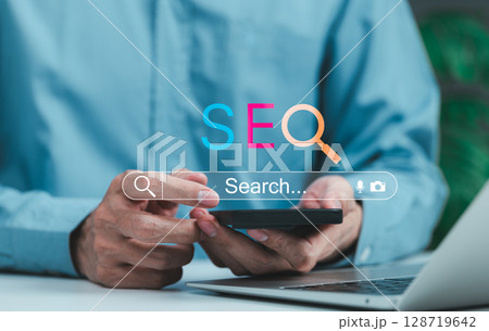 SEO Search Engine Optimization Digital Marketing Concept. Man using phone with SEO letters and search bar, online market, keyword research, website ranking, internet visibility for business growth, 128719642