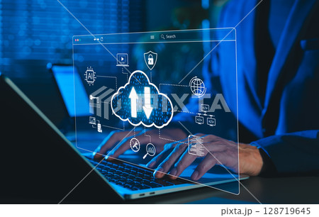 Cloud Computing and Data Technology Concept. Man using laptop with cloud icons and digital data symbol, representing cloud computing, data storage, cybersecurity, and AI integration in modern tech. 128719645