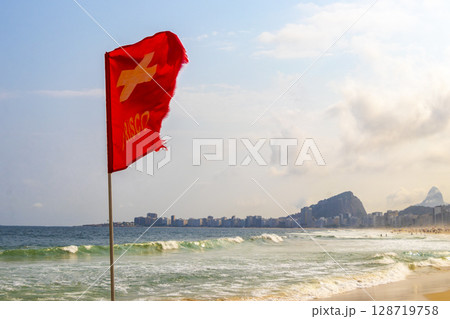 Red Flag on Copacabana Leme Beach Rio de Janeiro Brazil. 128719758