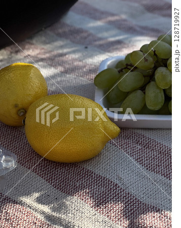 Fresh Lemons and Grapes on Picnic Blanket Fresh Lemons and Grapes on Picnic Blanket 128719927