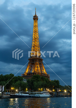 Eiffel Tower Illuminated at Night in Paris, France Eiffel Tower Illuminated at Night in Paris, France 128720996