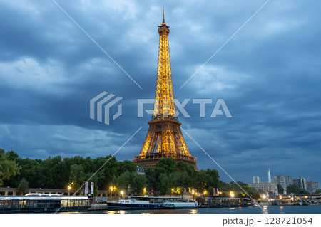 Eiffel Tower Illuminated at Night in Paris, France Eiffel Tower Illuminated at Night in Paris, France 128721054
