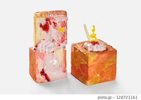 Two slices of pink toast with cream and raspberry on white background Two slices of pink toast with cream and raspberry on white background 128721161