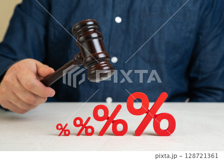 A judge with a gavel and rising interest rates. Regulatory decisions impacting financial markets, central bank policy changes, or government interventions. Inflation control, lending conditions 128721361