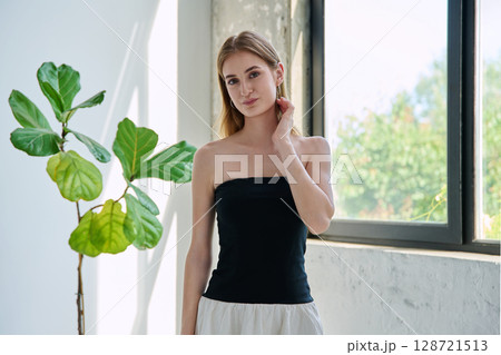 Portrait of beautiful fashionable young blonde woman with long hair 128721513