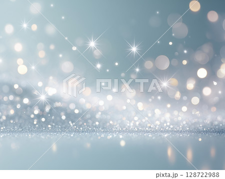 キラキラと光が舞う幻想的な青背景 キラキラと光が舞う幻想的な青背景 128722988