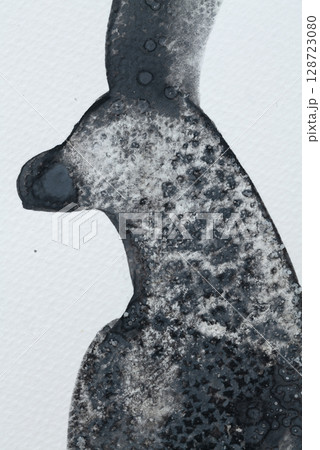 Unique black ink artwork featuring a silhouette of an animal against a textured background 128723080