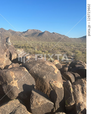 Ancient petroglyphs on rocks in Saguaro National Park, Arizona 128723602