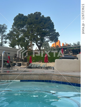 Resort pool with view of Sedona red rocks during sunset in Arizona 128723621