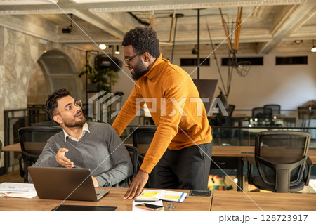 Colleagues working in the office and looking busy 128723917