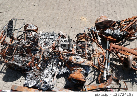 A pile of rusted metal and burnt debris A pile of rusted metal and burnt debris 128724188